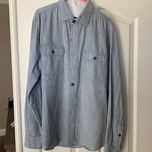 100% cotton.  Soft, light blue.